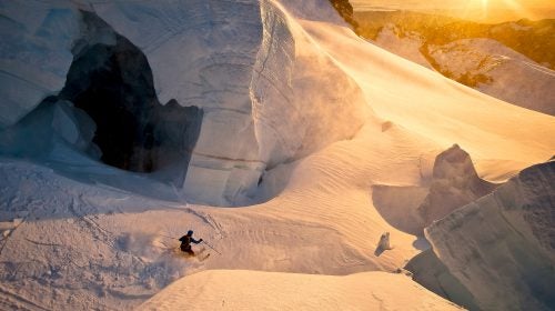 Out the backcountry gate, Mount Baker has incredible crevasses and similarly prodigious snow. Here, my brother Josh Hummel skis past a giant hole in an ice wall on Coleman Glacier in Mount Baker Wilderness, Washington.