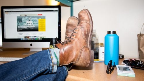 If you looked under the table at one of Outside’s morning news meetings, you’d notice a lot of leather boots on the feet of our male editors. Part of it has to do with style. Boots, jeans, and a flannel are sort of the office uniform. (It’s embarrassing how often we look alike.) Part of it also has to do with convenience. We’re a little lazy, and leather boots can be dirty and scuffed up and still look good. No single brand or style is most popular. Instead, everyone has their own favorite pair.
Red Wing Iron Ranger Boots ($320)
These rugged yet sleek leather boots were originally designed for iron miners in northern Minnesota. Which is to say: they’re built to withstand a lot of abuse. My pair, unsurprisingly, took a while to break in, but after a few weeks, the thick Amber Harness leather began to mold to my foot, leaving me with a comfortable and elegant boot that I’ve had for four years and will likely have for many more. My only complaint: the cork soles have no tread, and thus walking on snow or ice is a bit precarious. (Red Wing has since released a model with a grippy Vibram mini-lug outsole.) But I can’t really complain—it forces me to engage my small stabilizing muscles while walking, which is a good thing. Always be working, amirite? —Wes Judd, online fitness editor