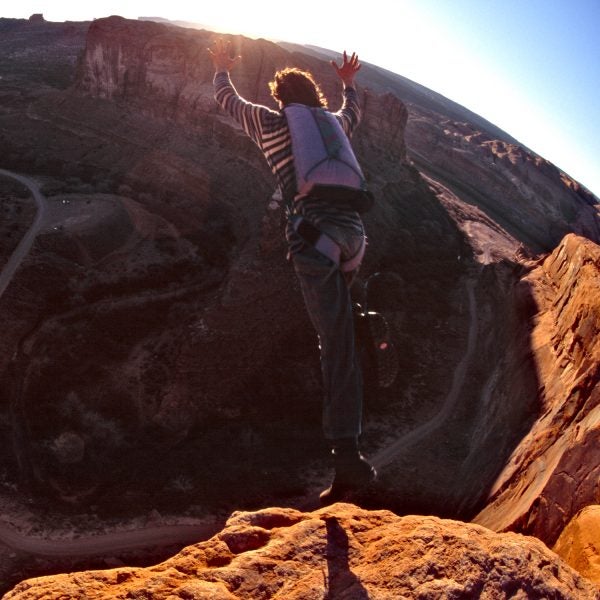 Dean Potter base jumping off the Tombstone cliff outside of Moab, Utah.