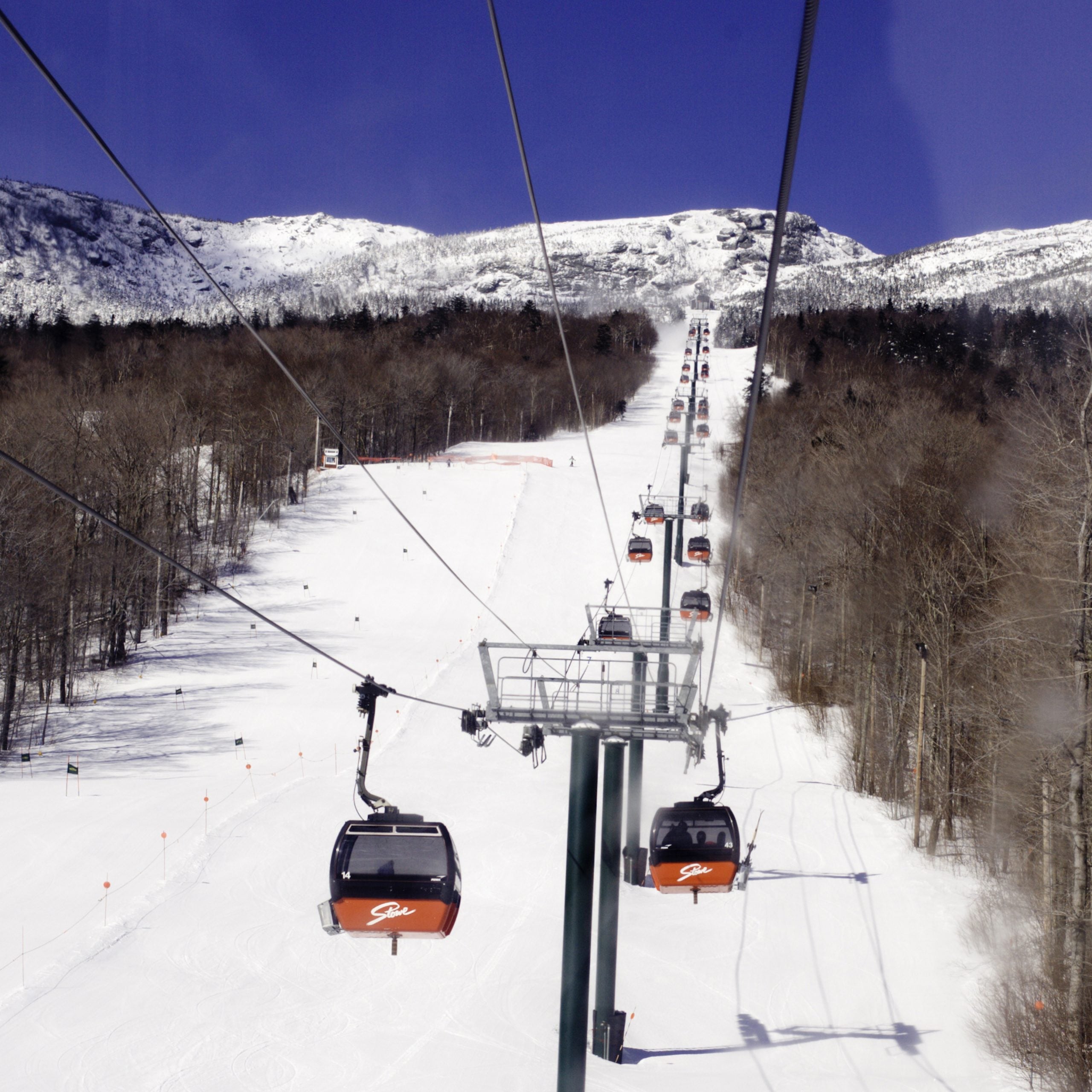 Skiers ride the gondola at Stowe Mountain Resort in Vermont.