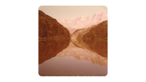 In 1979, 11 years old and armed with a Kodak Instamatic 110, photographer Andrew Phelps took his first image in the Grand Canyon on a trip with his father, Brent. Phelps shot four rolls of film that trip, but the square prints he developed upon his return didn’t do his memories justice. Ever since, and with a life dedicated to photography, he’s been trying to successfully capture the canyon. Thousands of frames later, and after nine trips over 34 years with his father, Phelps took to sorting through his work. The result is a 108-page book called Cubic Feet/Sec.
Phelps admits to failing at his goal of completely capturing the Grand Canyon’s beauty and what it means to him and his family. But as a collection, the book comes pretty damn close. Here, Phelps shares a few of his favorite frames and stories from more than three decades in the big ditch.
Phelps: This is very likely the first photograph I ever made. It’s in Marble Canyon just after the put-in and is image number one on roll one from my first trip through the canyon in 1979. I had four rolls of 12 exposure film that year.