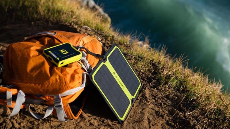 We get the appeal of clean, off-grid power, but the reality just hasn't caught up with your imagination yet. You're way better off just carrying a cheap battery pack.