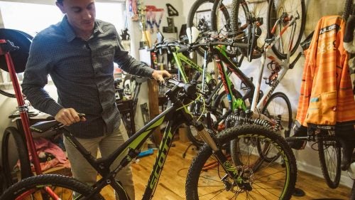 The star of the rack, Baddick’s Scott Spark race bike is “super light” and pretty easy to wrench on, he says.