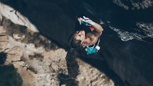 Margo Hayes, 19, of Boulder, made history last week by becoming the first woman to climb a 5.15a—the 131-foot La Rambla line up El Pati wall in Siurana, Spain.
Margo spent seven days working the route with fellow American climbers Matty Hong and Jon Cardwell. Hong had succeeded on the route just two days prior and Jon was very close. Margo started her ascent at around 4:25 p.m. on February 26. Applause, hoots, and hollers erupted in the canyon about half an hour later.
These behind-the-scenes photos follow her journey from the bottom of the crag to the anchors.
Photo: Hayes climbs into the crux sequence of La Rambla, 9a+, in Siurana, Spain.
Correction: The original version of this story incorrectly listed the climb as a 15.5a. We regret the error.