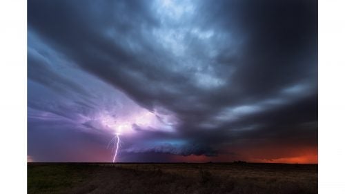 A storm that had previously dropped a tornado in New Mexico moves into Texas at sunset and creates some epic colors and lightning.