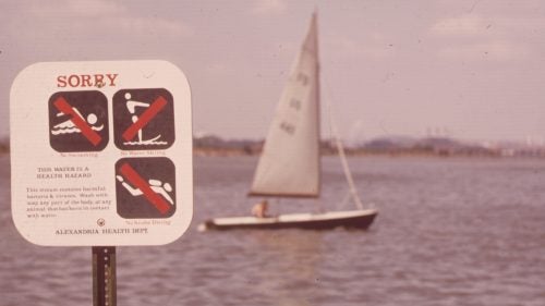 A sign at the edge of the Potomac River in 1972 warns against swimming due to severe water pollution.