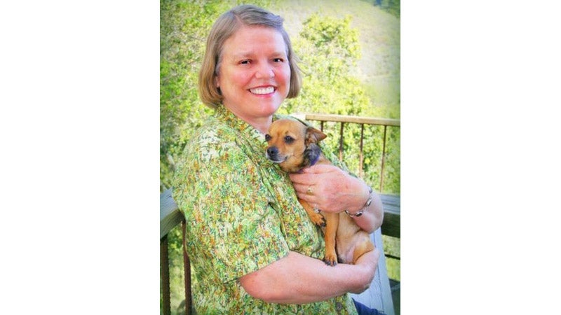 Betty, at home with her pooch. This isn't the face you'd typically associate with a survival story, but the reality of making things work through tough times isn't what it's most often portrayed as. Survival is the art of persistence.