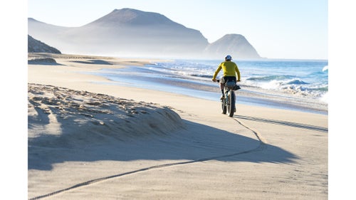 At the start of 2016, long-distance riders Nicholas Carmen and Lael Wilcox pioneered an unthinkably cool 1,700-mile mountain bike route. The ride begins in San Diego and finishes at the southern tip of Mexico’s Baja Peninsula. Dubbed the Baja Divide, the route has gained some traction among intrepid souls—including me and my friend Jordan Carr—looking to escape the grips of a cold winter.
Leaving behind one of the best Rocky Mountain winters in recent history, we traded ski boots for fat bikes in February and headed south. Twelve days, 283 miles, and more than a few beach beers later, we completed a section of the Baja Divide called the Cape Loop, which we started at San José del Cabo. Here are some highlights from our trip.
Photographs by Dylan Stucki.
Stucki: Carr goes out for a pre-coffee spin down the beach near Todos Santos, on the west coast of the Baja Peninsula. Moments before, a stray dog stumbled across our camp and wolfed down our entire breakfast while we were taking in the sunrise. So we made our way into town to resupply for the mountainous days ahead.