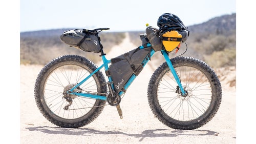We chose to ride fat bikes with four-inch-wide tires for our adventure, with the intention of getting in some serious beach miles. Although Carr’s setup was a bit overkill for most of the riding we did, the beach riding was a great way to mix things up. He used a Trek Farley fitted with Defiant pack bags. The seat bag carried clothes and up to three days’ worth of food at a time, while the custom-made frame bag housed a three-liter bladder, a jacket for quick access, flip-flops, and a book. The rolltop feed bag contained a mix of cookies, a knife, and our state-of-the-art navigating device: Carr’s iPhone.