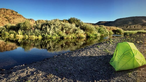 With headwaters in Nevada’s far north, the Owyhee River first winds through southwest Idaho’s high desert before crossing into Oregon. Near the state line, the river begins to cut deep—rushing some 150 miles through seas of bunchgrass and slot canyons that can reach 1,000 feet high—before flowing back east to Idaho to meet the Snake River.