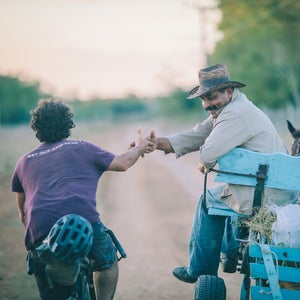 On January 1, my wife, Virginia, and I joined our riding buddy Joe Cruz and set out to cycle across Cuba using mainly rugged dirt tracks, horse paths, and mountain roads. As with all of our bikepacking trips, the objective was to dig ourselves into the backwaters of our new surroundings and find out what the country is really like. We began on the eastern coast, in the city of Santiago de Cuba, and rode through three mountain ranges, countless fishing and farming villages, and finally into Viñales, on the opposite coast. Ultimately, we discovered a country full of warm people, quirky eccentricities, and natural beauty. Here, Logan Watts, the editor at Bikepacking.com, shares a selection of images from their 860-mile, 20-day trip. Photo:Many times, folks insisted on stopping us to hear where we were from and where we were going. Other times, they just reached out their hand for a friendly shake.