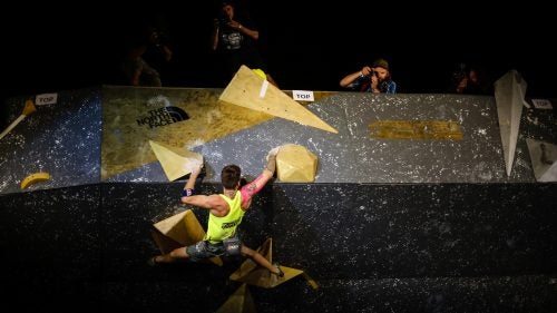 Felipe Camargo (Brazil) navigates his way over a protrusion during the finals' last route, which was comprised solely of volumes.
