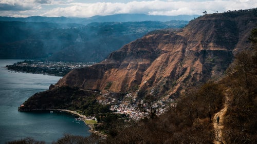 Here, Eric Porter rides the Santa Cat Trail into Santa Catarina de Palopo, on the shores of Lake Atitlán. The trail weaves through small farms before dropping down a series of staircases directly through town.