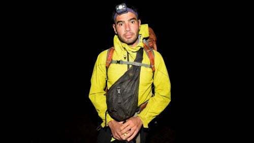 Ryan Moss poses for a portrait moments before taking the first steps of his most recent traverse of the Ko’olau Range.