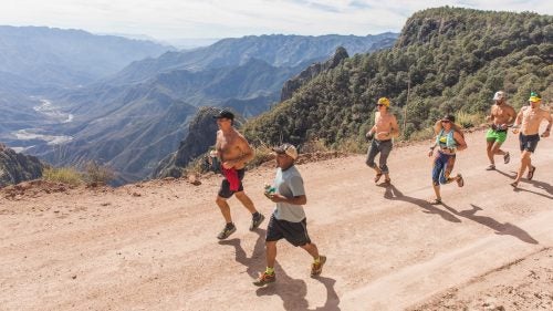 Among the most celebrated Tarahumara runners is Miguel Lara, who has won the Caballo Blanco several times and placed sixth in this year’s race. Lara (second from left) is accompanied on a 13-mile training run before the race by Michael Miller (far left), an American liaison for the race and a close friend of the late Micah True. In this photo, Miller carries a red shirt that once belonged to True.