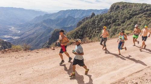 Among the most celebrated Tarahumara runners is Miguel Lara, who has won the Caballo Blanco several times and placed sixth in this year’s race. Lara (second from left) is accompanied on a 13-mile training run before the race by Michael Miller (far left), an American liaison for the race and a close friend of the late Micah True. In this photo, Miller carries a red shirt that once belonged to True.