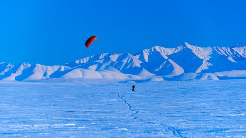 Traveling across the Arctic isn’t easy no matter how you do it, but Palmer, Alaska-based photographer Fredrik Norrsell and his wife, Nancy Pfeiffer, thought the winter landscape of the Arctic National Wildlife Refuge, north of the Brooks Range, would make for a nice ride. In April 2014, the couple covered about 75 miles using the wind and skis starting from the village of Kaktovik on the northern coast of Alaska. While most of the expedition was slow-going, with the right wind Norrsell and Pfeiffer could average near 10 miles per hour, with loaded sleds, just using the power of the wind. Here, Norrsell shares a few memories of the cold, breezy adventure.
Norrsell: Finally, after days of waiting, the wind began to blow and we were able to put our kites to the test.