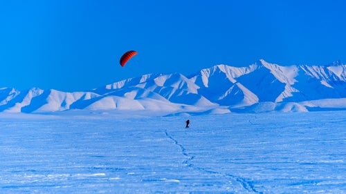 Traveling across the Arctic isn’t easy no matter how you do it, but Palmer, Alaska-based photographer Fredrik Norrsell and his wife, Nancy Pfeiffer, thought the winter landscape of the Arctic National Wildlife Refuge, north of the Brooks Range, would make for a nice ride. In April 2014, the couple covered about 75 miles using the wind and skis starting from the village of Kaktovik on the northern coast of Alaska. While most of the expedition was slow-going, with the right wind Norrsell and Pfeiffer could average near 10 miles per hour, with loaded sleds, just using the power of the wind. Here, Norrsell shares a few memories of the cold, breezy adventure.
Norrsell: Finally, after days of waiting, the wind began to blow and we were able to put our kites to the test.