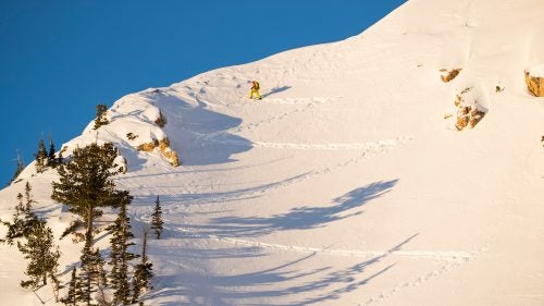Setting the skin track at sunrise up Cardiff Ridge to lap the Cardiff Chutelettes.