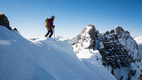 For the past five years, I’ve been working on a personal project to ski all 90 lines listed in Andrew McLean’s The Chuting Gallery, a skiing-climbing guidebook for Utah’s Wasatch Range. To my knowledge, I am the fourth person and first woman to complete the project. The routes described demand a wide range of skills: endurance for long vertical approaches, trad climbing, top-level ice climbing techniques, and the ability to make controlled ski turns in steep terrain.
A project of this magnitude was possible only because it’s in my backyard. Many of the Wasatch peaks are visible from the Salt Lake Valley and provide a true sufferfest minutes from a major metropolitan center. This season, I decided to focus my efforts on ticking off every last line in the book. I love the challenge the book provided, and I’m grateful for all the partners who shared these experiences with me.
Here, a look back at some of my favorite lines during the project.
Getting ready to drop into the Devil’s Castle Couloir at Alta. Surprisingly, this was one of the tricker lines in the book to ski, despite its relatively easy access. It’s very steep, and for how high and north facing it is, the snow doesn’t stay soft for long. It took me several tries to successfully ski this one.