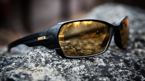 Julbo’s Dirt 2.0 sunglasses have photochromic lenses that adjust to low light when Smith is working in thick forests or deep canyons. He also wears them to protect against helicopter rotor wash and while bushwhacking through heavy brush. The only downside: they’re not dark enough for a bluebird winter day, when the sun bounces off the snow.