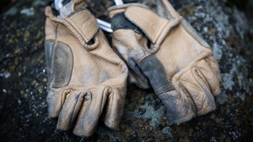 Smith needs gloves to protect his hands during the rope work and knuckle bashing of a big-wall technical rescue and during a long carry-out of a patient in a litter. Metolius’s Climbing Gloves are his favorite for a few reasons. They fit his fingers, which are swollen from decades of climbing use, plus the half-finger design provides ventilation and dexterity.