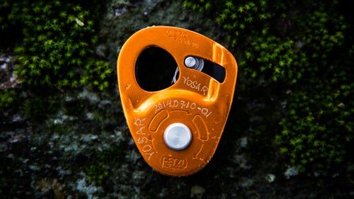 The Petzl Micro Traxion is a tiny progress-capture pulley, and Smith uses his frequently. Rescue standards call for three pieces of attachment to a rope, so he’ll toss this on a rope between his ascenders. It’s also easy to use for self-belaying or with any hauling system.