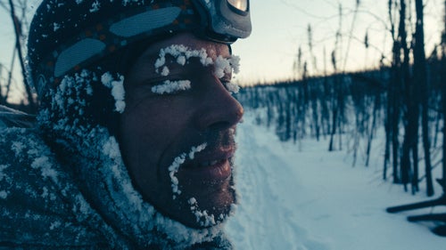 On February 26, 2017, I joined 70 racers at the start line of the annual Iditarod Trail Invitational, a bikepacking race along the Iditarod Trail across the Alaskan backcountry, which takes place at the same time as the dogsled race. Participants are self-supported, carrying all of their own clothing, camping, and cooking gear, with food drops shipped ahead along the trail. This year’s race was fraught with frigid temperatures that frequently dropped to minus 40. Of the 25 racers intending to race the 1,000 miles to Nome, only six would finish. Here’s a series of images from my 18-day, 1000-mile sufferfest. Photo: Martijn Boonman, a fellow racer I rode with for several days, soaks up the rising sun and the hint of warmth it brings. Keeping dry was a critical, daily chore. The cold temperatures combined with the perspiration and moisture from breathing built up a constant layer of frost on our face and clothing. Photos and words by RJ Sauer.