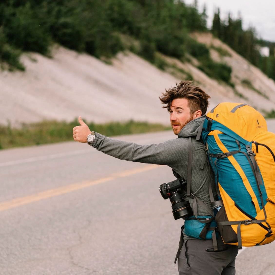 Chris Brinlee Jr. hitching a ride to the middle of nowhere—with his camera gear, of course.