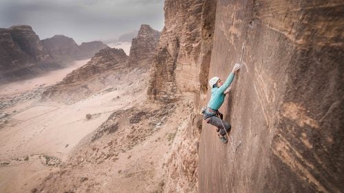 This January, in the heart of the Middle East, a crew of rock climbers set out to establish an 1,800-foot, 14-pitch, 5.13+ route up Jordan’s Jebel Rum. On the outskirts of Wadi Rum, a region in the southern part of the country, the team composed of Mohammad Hussein, Madaleine Sorkin, Elad Omer, and Eli Nissan linked up with the local Bedouin people who have been working hard to establish a market for adventure tourism. After three weeks of cleaning and searching for the best routes, the climbing team left without the opportunity or time for a free ascent. Just two weeks later, another team from the Czech Republic free-climbed the route in a continuous two-day effort with the blessing of the establishing crew. Colorado-based filmmaker Henna Taylor, who is making a movie about the route’s creation, shares her best shots from the initial trip. Photo: Boulder, Colorado–based pro climber Madaleine Sorkin attempts the fourth and most difficult pitch (5.13d) on the project we named the Sultan ul-Mujahidin, which translates to “Sultan of the Freedom Warriors.”