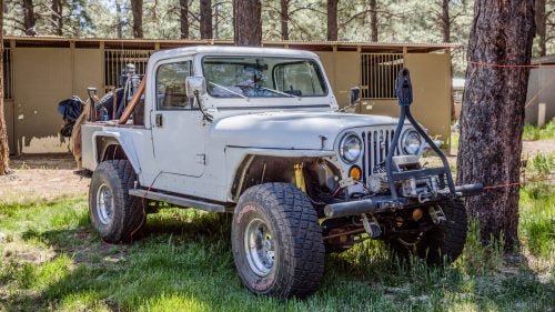 1993 Jeep CJ-8
Toyotas get a lot of love in the overlanding community, but the venerable Jeep Wrangler (in all it’s many forms) is a classic American 4x4 that we’d be remiss to leave out. We chose this heavily modified Jeep CJ-8 Scrambler because it’s both rare and awesome. Produced between 1981 and 1986, it has a longer wheelbase than the CJ-7 and a truck-bed-like rear, meaning you got more storage space and the same trail worthiness. Owner Ken Josten swapped in heavy-duty axles and is running 35-inch tires.