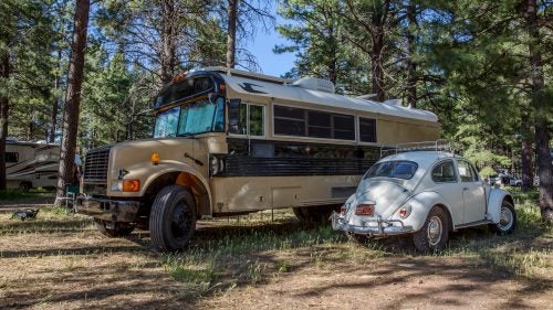 1995 Bluebird School Bus and 1967 Volkswagen Beetle
Larry Stuber calls his bus the Ark, and he specifically chose a Bluebird model because repair parts are available in various countries around the world. (He plans to take it to South America eventually.) Inside, there’s enough room to sleep four, plus a toilet, shower, kitchen, and solar electricity. Stuber tows his 1967 Beetle with all-terrain tires and uses the car to explore once he and his family have picked a camp spot.