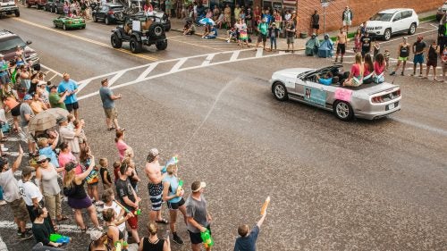 Local residents look on as Miss Trail Days 2017, Morgan Wolf, along with 2016 Teen Miss Trail Days Ally Manuel, Young Miss Trail Days Audra Larson and Junior Miss Trail Days Kendra Harding lead the annual parade. (Not pictured: Petite Miss Trail Days, Mini Miss Trail Days, and Toddler Miss Trail Days.) For 20 years, the pageant was a defining event for the town of Damascus but was canceled this year due to low contestant entries.
