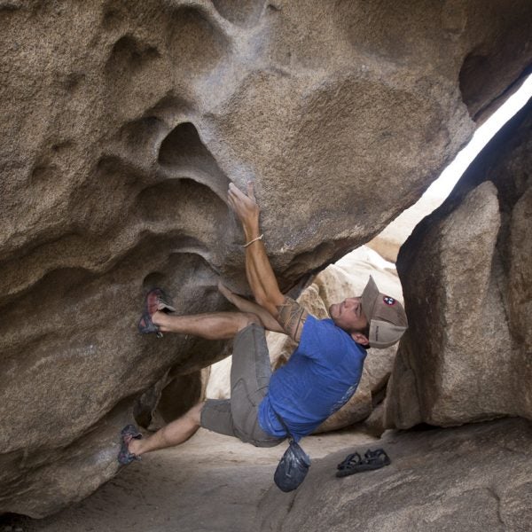 Some beginners prefer bouldering, which doesn't require as much gear and avoids 100-foot heights. Here, a climber boulders in California's Joshua Tree National Park.