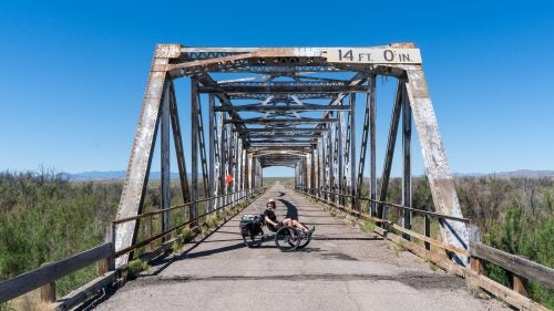 I’ve ridden and loved bikes for 35 years, raced since I was ten, and idolized the greats like Greg Lemond, Bernard Hinault, and Andy Hampston. Cycling is in my blood, and to me it always meant two wheels—until now.
Sixteen months ago, I broke my arm. Everyone said it was a minor break, but the injury festered. The pain worsened, and doctors shook their heads. And then, almost a year to the day, I rebroke it trail running. I started going crazy: I couldn’t ride a regular bike, nor I could I run, do yoga, hunt, or fly-fish.
Then one day, in a moment of frustration, I started looking for recumbent, three-wheeled bikes that could handle dirt. For “serious” cyclists, a recumbent, or trike, is about as appealing as training wheels. I’d never considered riding one, but soon found the Terra Trike Rambler All-Terrain, a brand-new design that landed on my doorstep a few weeks later. And though I hadn’t ridden it yet, and though I’d been couch-bound, and though I had only a week until I left for a photography assignment in Jordan, I concocted a trikepacking tour of the backroads of New Mexico. Four days, three nights, and several hundred miles later, I was sold.
The Rambler takes all the good parts about cycling and leaves out the bad. (More on that below.) Just off the couch and on a two-wheel bike, I would never have been able to log as much time as I did and see so much country. The Rambler, however, gave me the freedom to get out and enjoy what I love. Which is why, though I’ll never completely divorce my bicycle, I foresee a lasting affair with the trike.