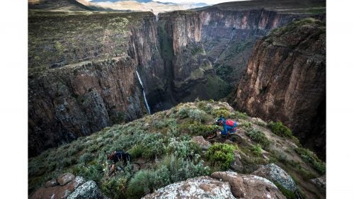 In April 2017, I joined mountain bikers Kevin Landry and Claudio Caluori to ride and photograph a six-day, 120-mile traverse through the landlocked country of Lesotho, in South Africa. Our trip was put together by the organizers of the Lesotho Sky mountain bike race, who are trying give the country a tourism bump by highlighting its riding. They have an easy case to make. Beginning at the 630-foot high Maletsunyane Waterfall in the middle of the country, we found top-notch mountain biking between 10,000-foot peaks, along wild valleys, and through countless remote towns. Photo: Lesotho is a poor nation and heavily reliant on its encircling neighbor, South Africa, for economic progress. Even the 100-rider Lesotho Sky race, which started in 2011 and is taking place again this fall, is hindered by the country’s lack of infrastructure. That said, the rugged beauty of Lesotho’s landscapes will turn heads—though the exposure on many of its trails meant that wasn’t a possibility while riding.