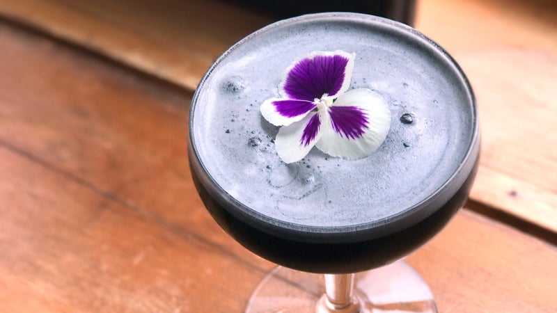 At Whiteface Lodge, mixologist Zachary Blair created a mezcal cocktail with activated charcoal.