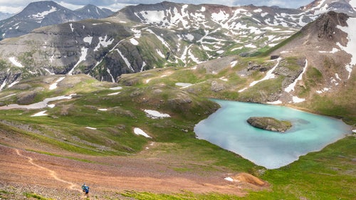 At mile 82.5, competitors descend past Island Lake, an iconic spot along the Hardrock course located just above 12,000 feet.
