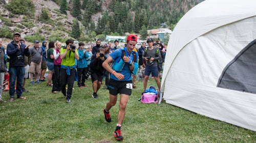 Last weekend was the 26th running of the Hardrock 100, a brutal ultramarathon in Southwestern Colorado’s San Juan mountains that has an average elevation of 11,000 feet. The two-day event was filled with drama and excitement—defending co-champion Jason Schalrb was forced to drop at mile nine due to a stomach bug, and women’s race leader Caroline Chaverot took a wrong turn at mile 70. Most notably, though, Kilian Jornet won for the fourth year in a row, despite falling and dislocating his shoulder at mile 14, popping it back into place himself, and running the remaining 86 miles with his left arm in a makeshift sling. This victory came just two months after the 29-year-old Spaniard summited Everest twice in one week.
Here’s a behind-the-scenes look at how the race unfolded.
Photo: Kilian, at mile 56, leaving the Ouray aid station.