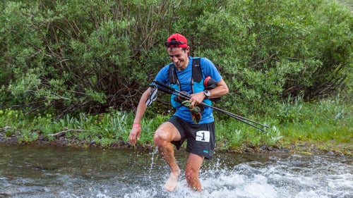 Kilian Jornet tries to keep his feet dry by crossing the first stream, at mile nine, without his shoes, an inefficient strategy he would later abandon.
