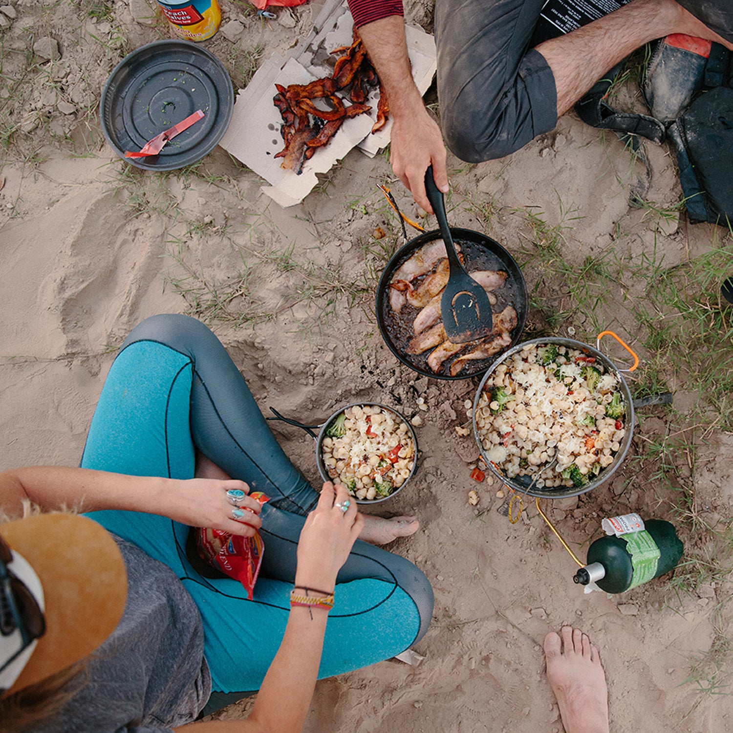 The JetBoil Genesis system uses one propane bottle for multiple burners.