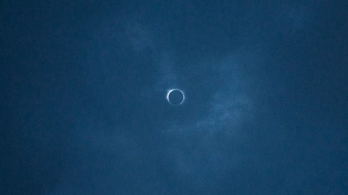 THE APPALACHIAN TRAIL, NEAR FRANKLIN, NORTH CAROLINA – 08/21/2017: During the 2 minutes, 45 seconds of total eclipse, a faint halo could be seen pushing through thin clouds. August’s full solar eclipse is the first visible from the United States since 1979. Traveling over 14 states on its way east, from Oregon to South Carolina, the eclipse passes over the southern end of the Appalachian Trail - a 2,200-mile wilderness hike that winds from Georgia to Maine. CREDIT: Spike Johnson for Outside Magazine.