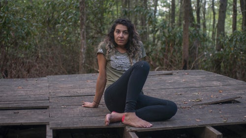 THE APPALACHIAN TRAIL, NEAR FRANKLIN, NORTH CAROLINA – 08/21/2017: Yalda Jam, 32, at Carter Gap. Jam; who has traveled from Houston, Texas, hikes towards Albert Mountain to watch the solar eclipse pass over the Appalachian Trail. She has arranged her three-day section hike around the eclipse, her first time on the AT. “I’ve always wanted to see an eclipse,” she said, “and to watch one while hiking part of the AT is awesome.” CREDIT: Spike Johnson for Outside Magazine.
