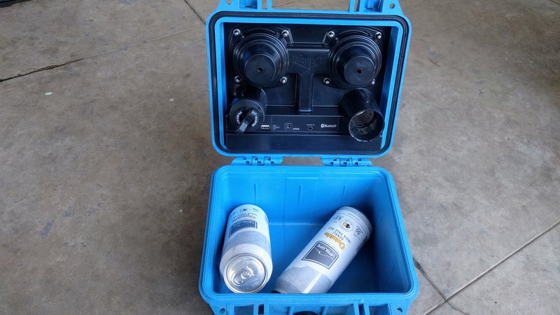 Housed under the lid are the coated, waterproof circuit board, the USB, 3.5mm, and AC power ports, and the bass tube plug. The rest of the space you can fill with whatever you want.