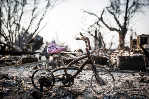 A bike sits the burned out Coffey Park neighborhood of Santa Rosa, California on October 13, 2017. As of Friday night, the Tubbs Fire had burned more than 2,000 homes in the Santa Rosa area.