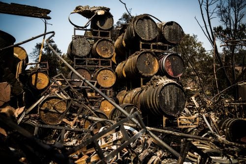 Racks of wine barrels sit in the remains of the Paradise Ridge Winery in Santa Rosa, California on October 13, 2017. As of Friday night, the Tubbs Fire had burned more than 2,000 homes in the Santa Rosa area.