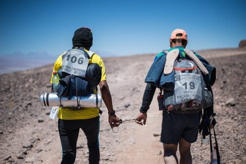 After the valley of death and tunnel crossing, Vlad and Iniceto arrive at a ridge where they are able to absorb the view of the huge part of the the course completed. From the green vegetation along the river crossings to the mars like uphill terrain of the valley of depth. Always with the majestic Licancabur Volcanoe overlooking them.