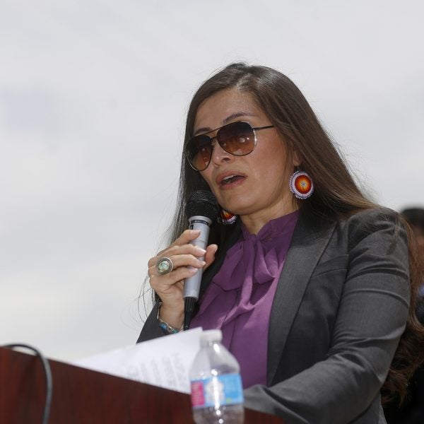 Navajo Nation Attorney General Ethel Branch speaks Tuesday, Aug. 16, 2016, at Nizhoni Park in Shiprock, N.M. Leaders of the Navajo Nation, one of the nation's largest American Indian tribes, blasted the U.S. Environmental Protection Agency as their attorneys sued Tuesday, claiming negligence in the cleanup of a massive mine waste spill that tainted rivers in three Western states. (Jon Austria/The Daily Times via AP)