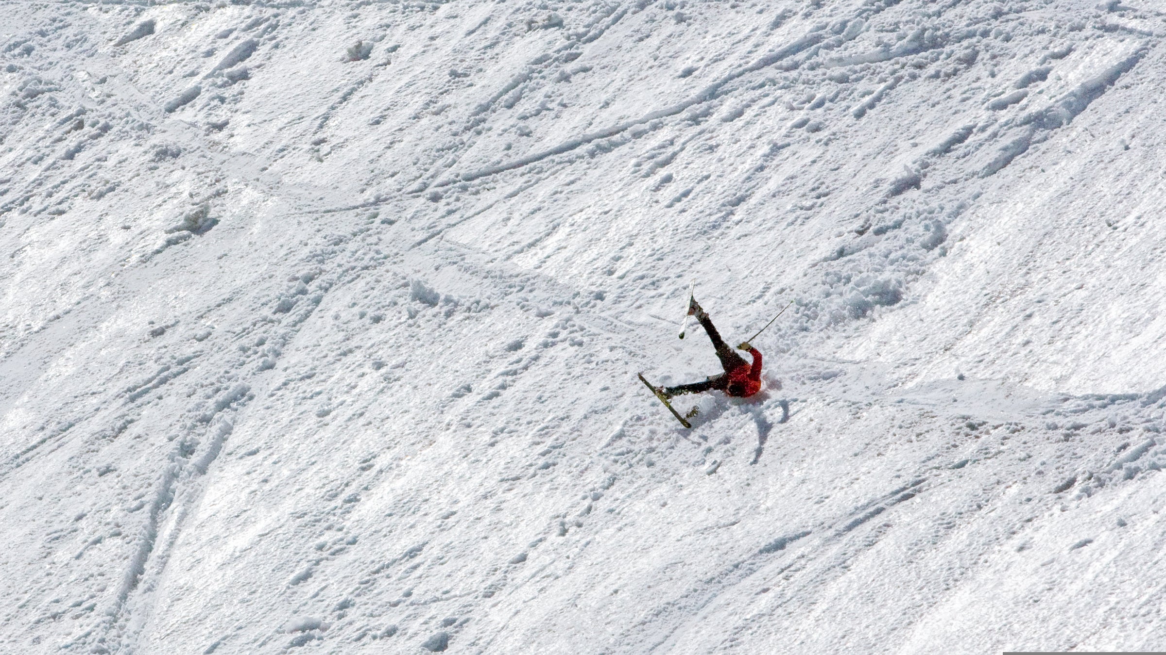 A man falls while skiing Tuckerman Ravine on Mt. Washington.