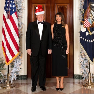 President Donald J. Trump and First Lady Melania Trump are seen Tuesday, December 5, in their official 2017 Christmas portrait, in the Cross Hall of the White House in Washington, D.C.